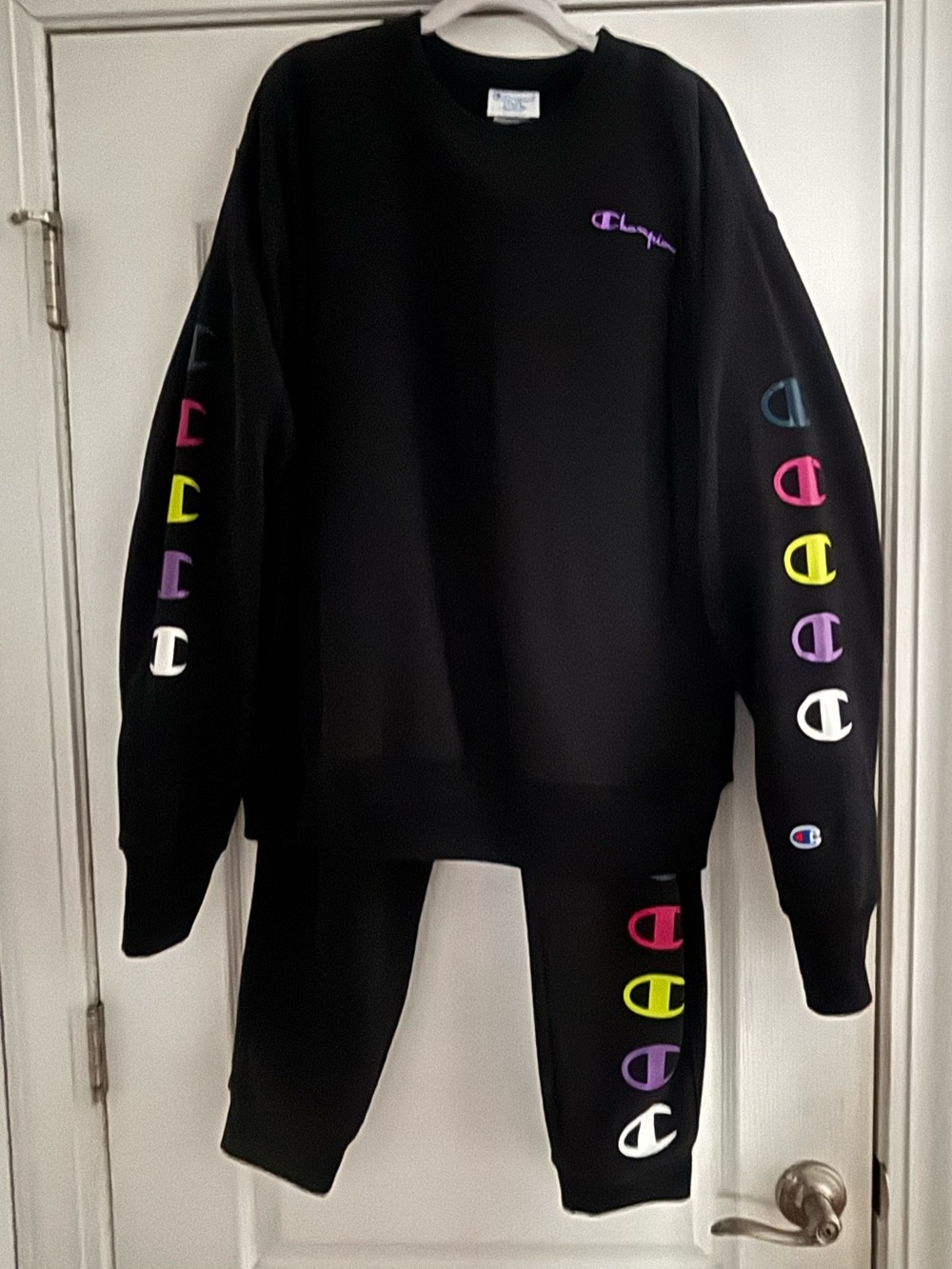 Champion Black Crewneck Sweatshirt & Jogger
Pants with Multicolor Sleeve Logos